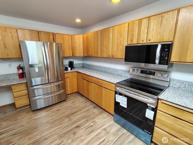 659 Cain Lake Rd, Sedro Woolley, WA 98284 - kitchen with stainless steel appliances, light wood-type flooring, light stone countertops, and recessed lighting