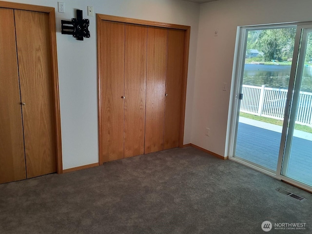 659 Cain Lake Rd, Sedro Woolley, WA 98284 - unfurnished bedroom with carpet floors, access to exterior, and baseboards