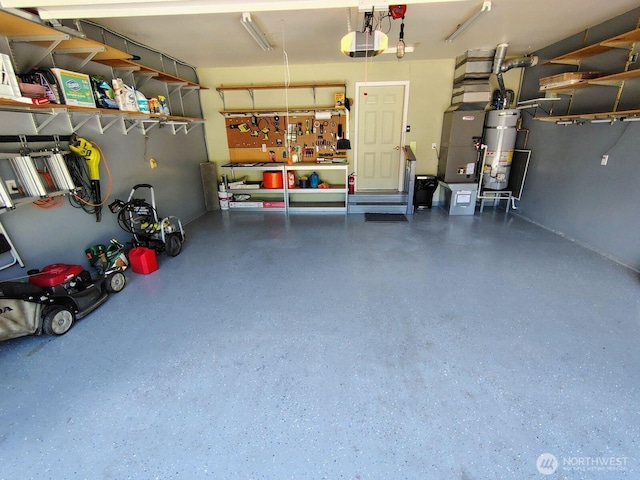 659 Cain Lake Rd, Sedro Woolley, WA 98284 - garage featuring a garage door opener, secured water heater, and a workshop area