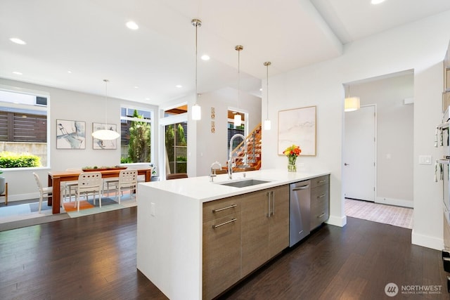 21955 SE 30th Pl, Sammamish, WA 98075 - kitchen featuring a sink, stainless steel dishwasher, light countertops, dark wood-style floors, and modern cabinets