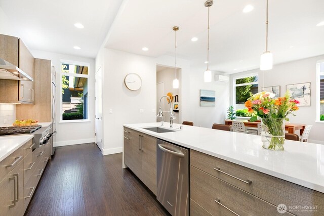 21955 SE 30th Pl, Sammamish, WA 98075 - kitchen with stainless steel appliances, a sink, light countertops, dark wood-type flooring, and recessed lighting