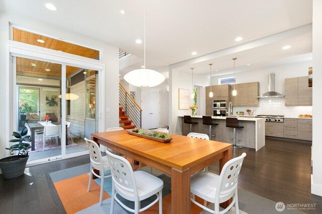 21955 SE 30th Pl, Sammamish, WA 98075 - dining space featuring dark wood-type flooring, stairs, and recessed lighting