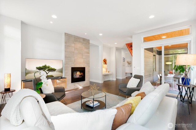 21955 SE 30th Pl, Sammamish, WA 98075 - living room with wood finished floors, recessed lighting, a fireplace, and baseboards