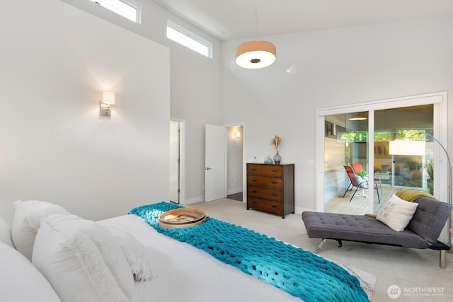 21955 SE 30th Pl, Sammamish, WA 98075 - bedroom with carpet flooring, access to exterior, a towering ceiling, and baseboards
