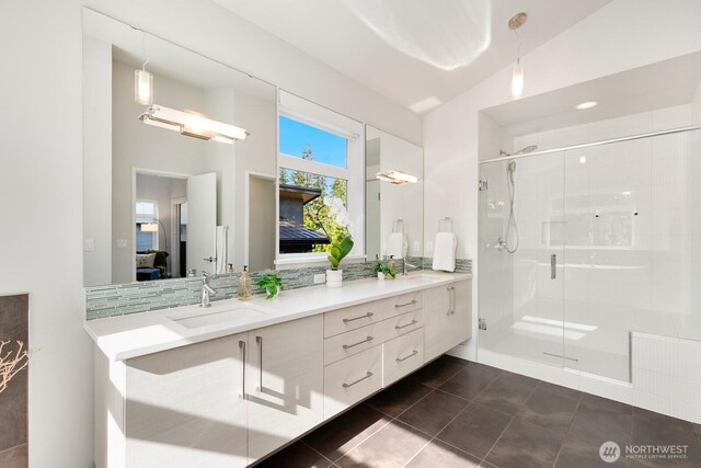 21955 SE 30th Pl, Sammamish, WA 98075 - ensuite bathroom featuring double vanity, a shower stall, and tile patterned flooring