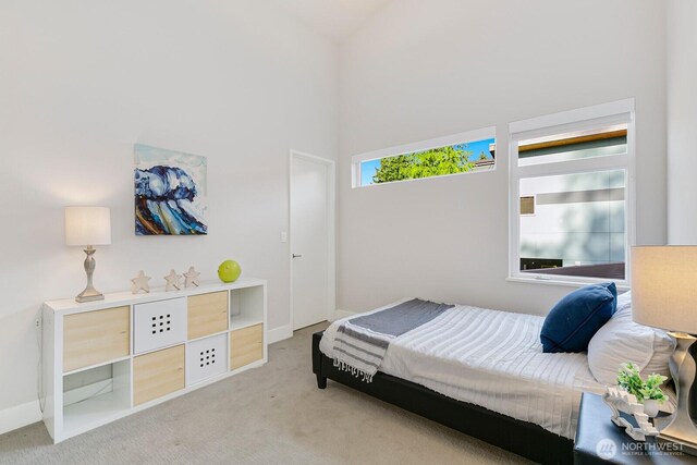 21955 SE 30th Pl, Sammamish, WA 98075 - bedroom with carpet, a towering ceiling, and baseboards