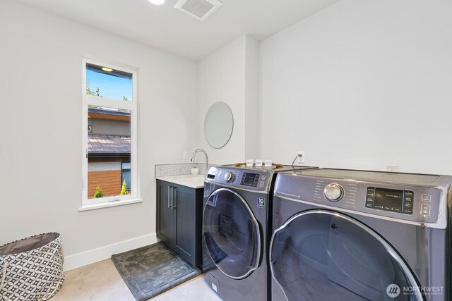 21955 SE 30th Pl, Sammamish, WA 98075 - laundry room with independent washer and dryer, baseboards, cabinet space, and tile patterned flooring