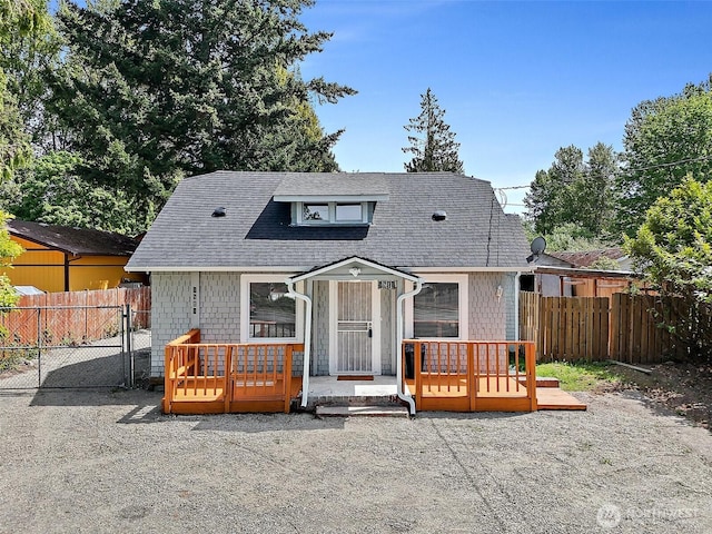 9819 Park Ave S, Tacoma, WA 98444 - view of front facade with fence, a gate, and a shingled roof
