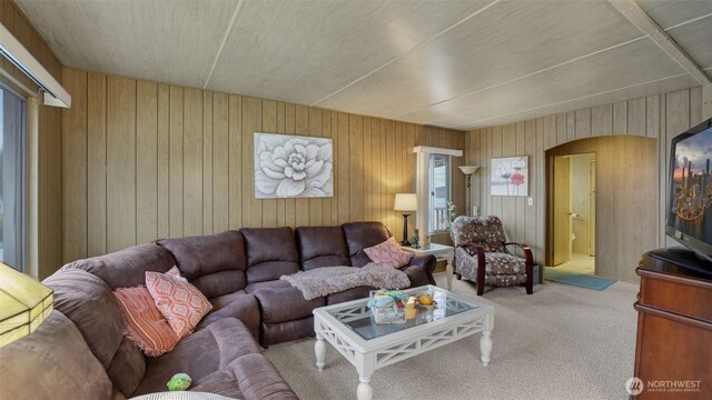 2101 S 324th St Unit 9, Federal Way, WA 98003 - carpeted living area featuring wood walls and arched walkways