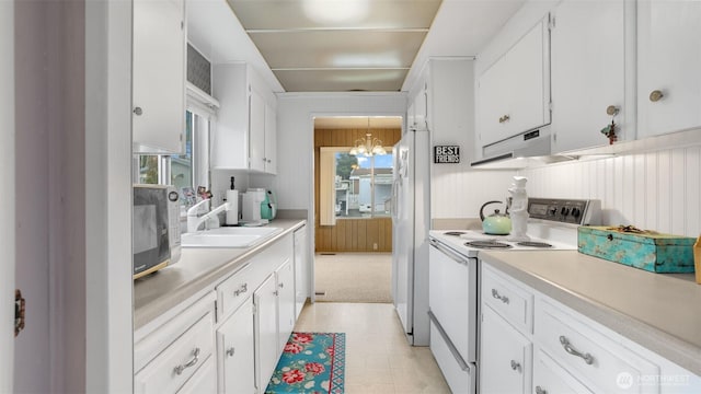 2101 S 324th St Unit 9, Federal Way, WA 98003 - kitchen with white appliances, a chandelier, a sink, and light countertops