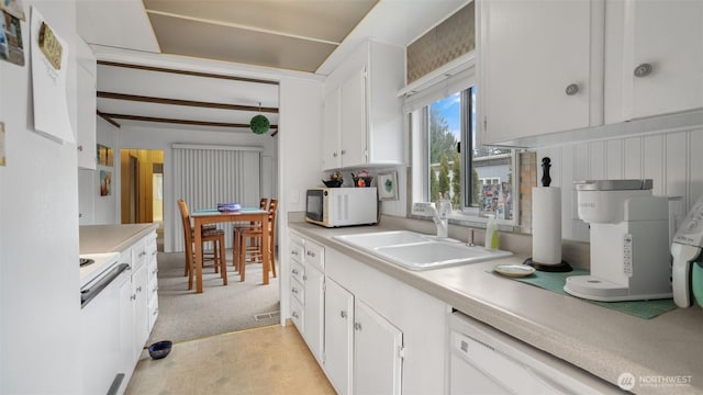 2101 S 324th St Unit 9, Federal Way, WA 98003 - kitchen with white appliances, a sink, light countertops, white cabinetry, and light carpet
