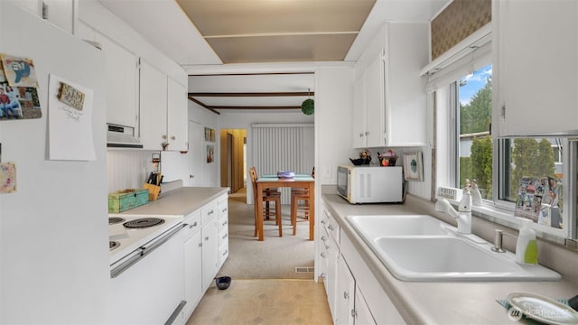2101 S 324th St Unit 9, Federal Way, WA 98003 - kitchen with white appliances, under cabinet range hood, a sink, white cabinets, and light countertops
