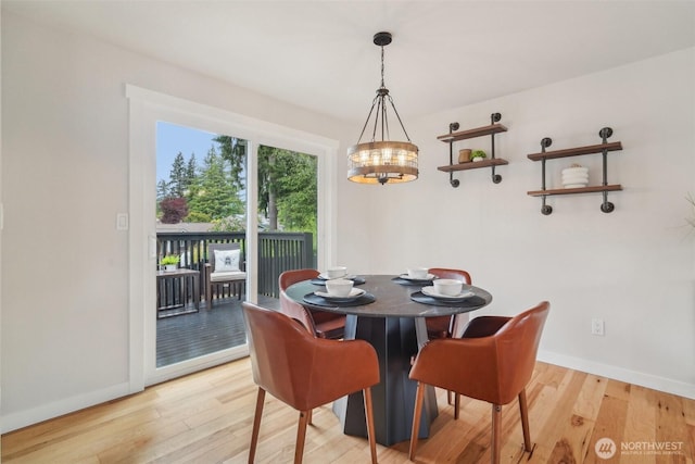 429 217th Pl SW, Bothell, WA 98021 - dining room with light wood-type flooring, baseboards, and a chandelier