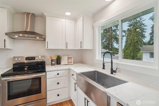 429 217th Pl SW, Bothell, WA 98021 - kitchen featuring electric stove, wall chimney exhaust hood, a sink, tasteful backsplash, and light stone countertops