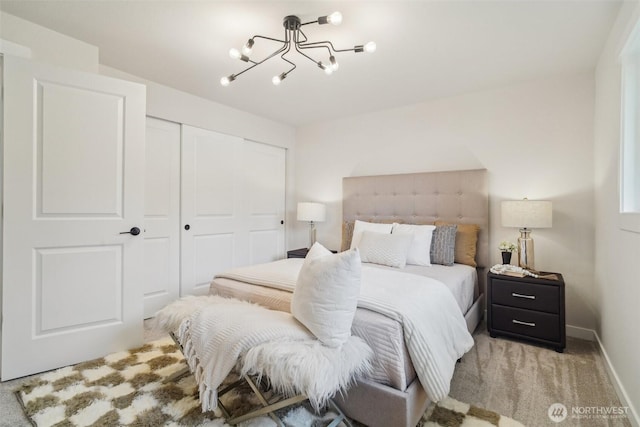 429 217th Pl SW, Bothell, WA 98021 - bedroom with a closet, a chandelier, carpet, and baseboards