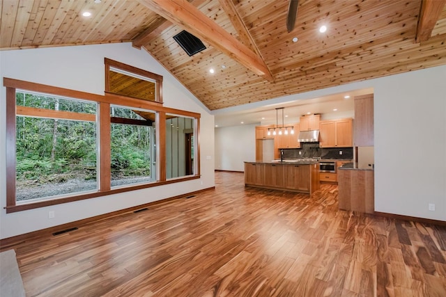 2075 NW Peterson Rd, Poulsbo, WA 98370 - living room featuring light wood-style floors, wood ceiling, baseboards, high vaulted ceiling, and beam ceiling