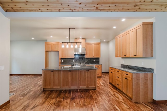2075 NW Peterson Rd, Poulsbo, WA 98370 - kitchen featuring ventilation hood, dark wood-style flooring, tasteful backsplash, baseboards, and recessed lighting