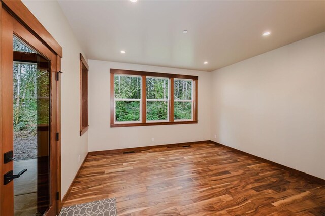 2075 NW Peterson Rd, Poulsbo, WA 98370 - spare room featuring plenty of natural light, wood finished floors, recessed lighting, and baseboards