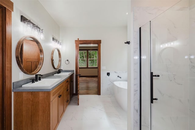 2075 NW Peterson Rd, Poulsbo, WA 98370 - bathroom featuring a shower stall, a soaking tub, double vanity, marble look tiles, and tile walls