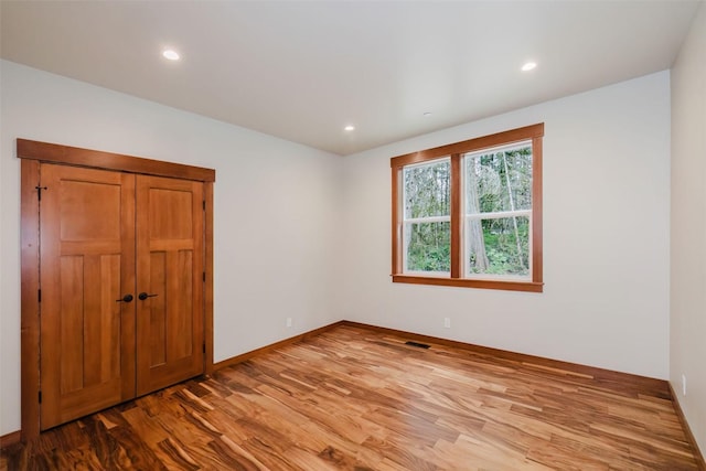 2075 NW Peterson Rd, Poulsbo, WA 98370 - spare room featuring wood finished floors, recessed lighting, and baseboards