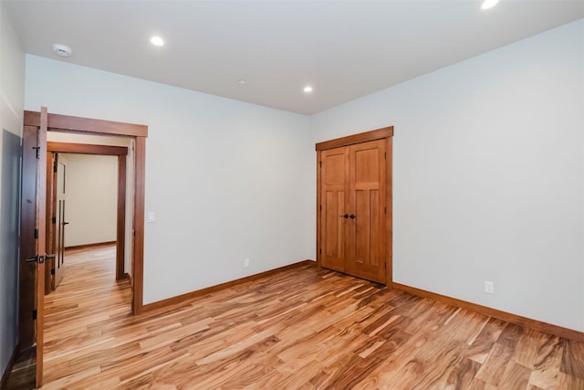 2075 NW Peterson Rd, Poulsbo, WA 98370 - empty room featuring light wood-type flooring, baseboards, recessed lighting, and a smoke detector