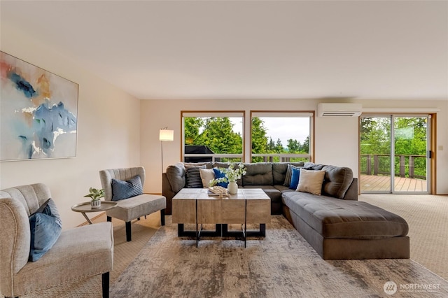 living room with an AC wall unit, carpet, and plenty of natural light