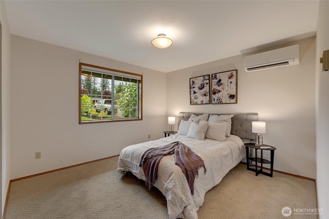 bedroom featuring a wall mounted AC, carpet flooring, and baseboards