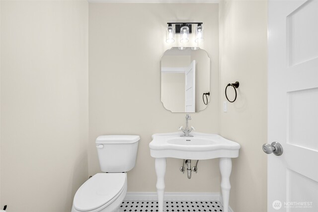 691 N W Camano Dr, Camano Island, WA 98282 - half bathroom with baseboards and toilet