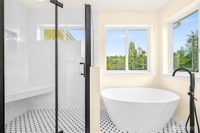 691 N W Camano Dr, Camano Island, WA 98282 - full bathroom featuring a soaking tub, a stall shower, and baseboards