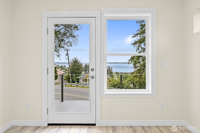 691 N W Camano Dr, Camano Island, WA 98282 - doorway with plenty of natural light, wood finished floors, and baseboards