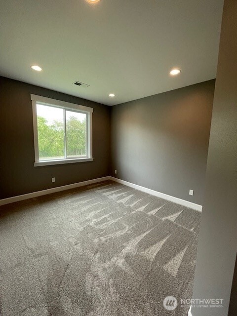 9 Columbia View Dr, Brewster, WA 98812 - spare room featuring baseboards, recessed lighting, and carpet flooring