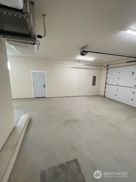 9 Columbia View Dr, Brewster, WA 98812 - garage with electric panel and a garage door opener