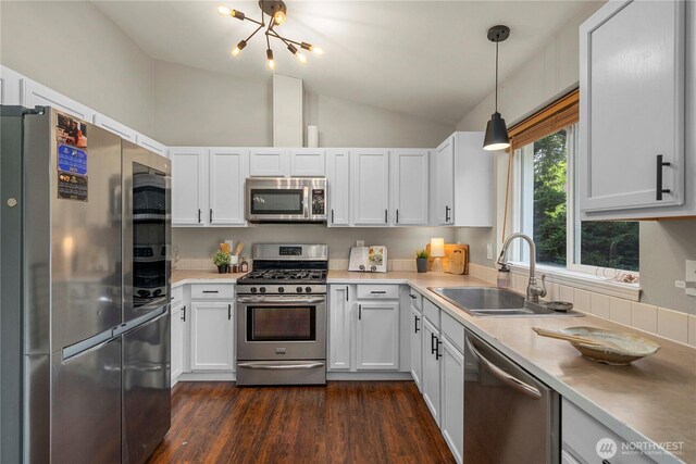 13014 97th Ave NW, Gig Harbor, WA 98329 - kitchen with stainless steel appliances, a sink, a chandelier, dark wood-style floors, and light countertops