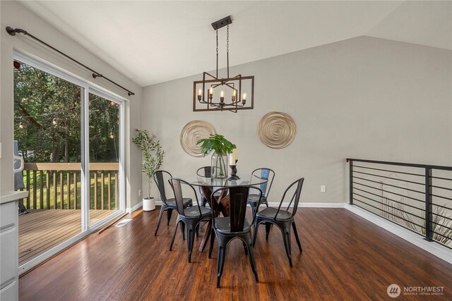 13014 97th Ave NW, Gig Harbor, WA 98329 - dining space featuring vaulted ceiling, wood finished floors, a chandelier, and baseboards