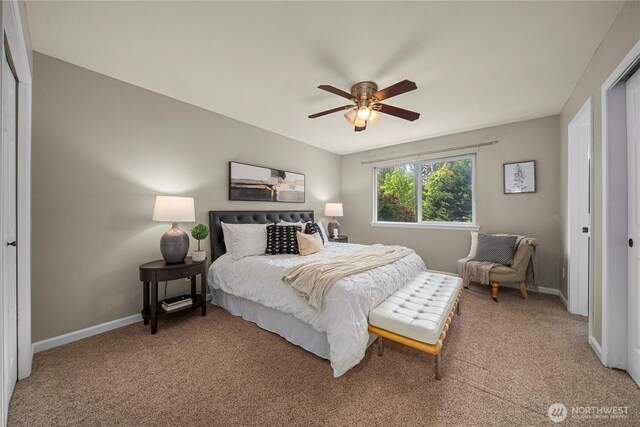 13014 97th Ave NW, Gig Harbor, WA 98329 - bedroom with baseboards, light carpet, and a ceiling fan