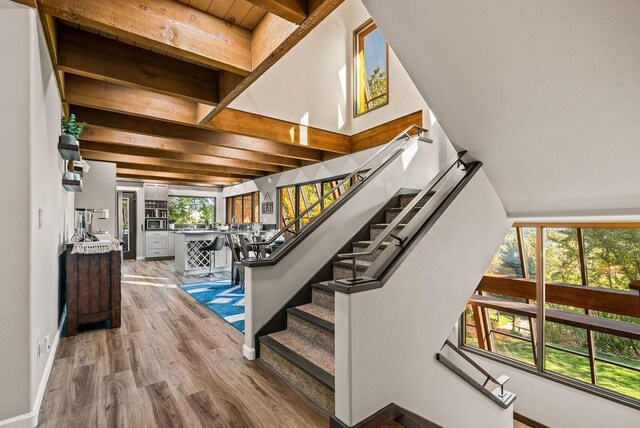 4706 Scenic Dr, Yakima, WA 98908 - staircase featuring wood finished floors, baseboards, and beamed ceiling