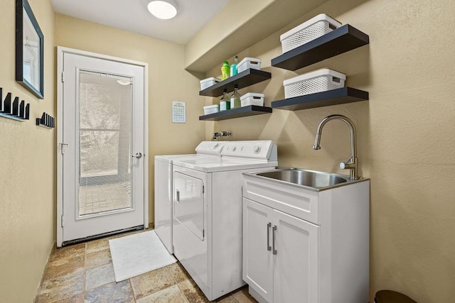 4706 Scenic Dr, Yakima, WA 98908 - washroom with independent washer and dryer, light stone finish flooring, and cabinet space
