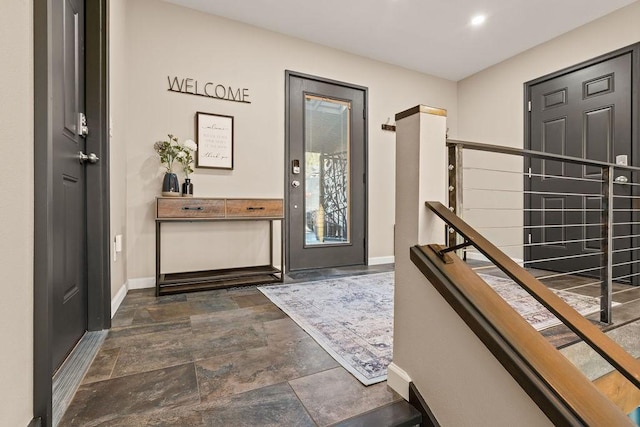 4706 Scenic Dr, Yakima, WA 98908 - foyer entrance featuring baseboards and dark stone finish flooring