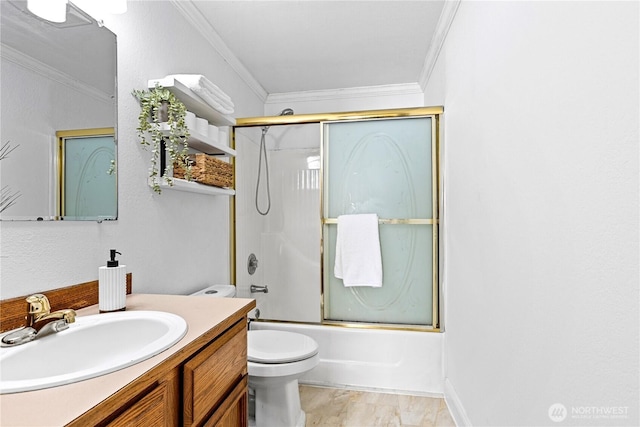full bath featuring ornamental molding, vanity, enclosed tub / shower combo, and toilet