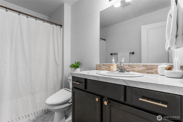 2080 Thornton St, Ferndale, WA 98248 - bathroom with decorative backsplash, toilet, and vanity