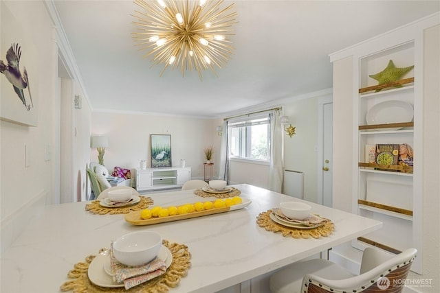 dining area with a chandelier and ornamental molding