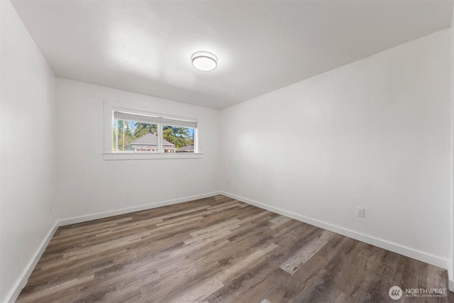8322 Wabash Ave S, Seattle, WA 98118 - spare room featuring wood finished floors and baseboards