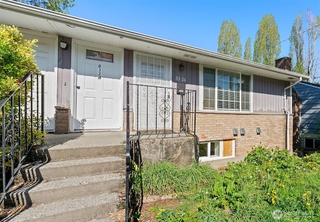8322 Wabash Ave S, Seattle, WA 98118 - view of front of home with brick siding and a chimney