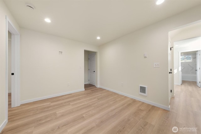 8322 Wabash Ave S, Seattle, WA 98118 - spare room with light wood finished floors, baseboards, and recessed lighting