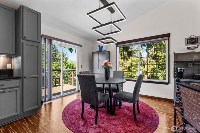 2419 53rd Street Ct NW, Gig Harbor, WA 98335 - dining area with dark wood-style flooring and baseboards