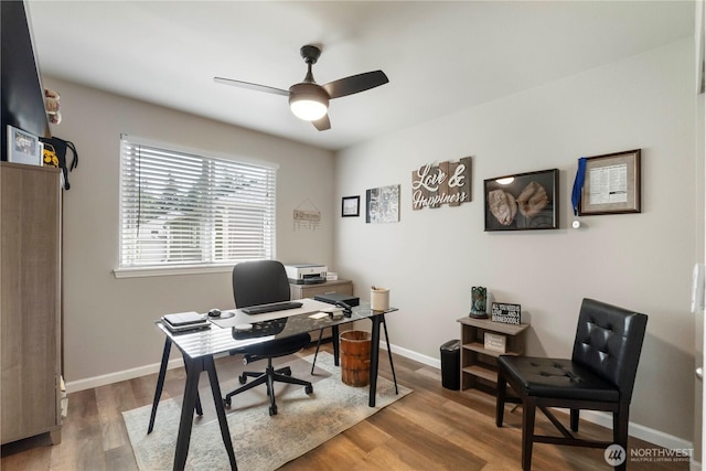 office with a ceiling fan, wood finished floors, and baseboards
