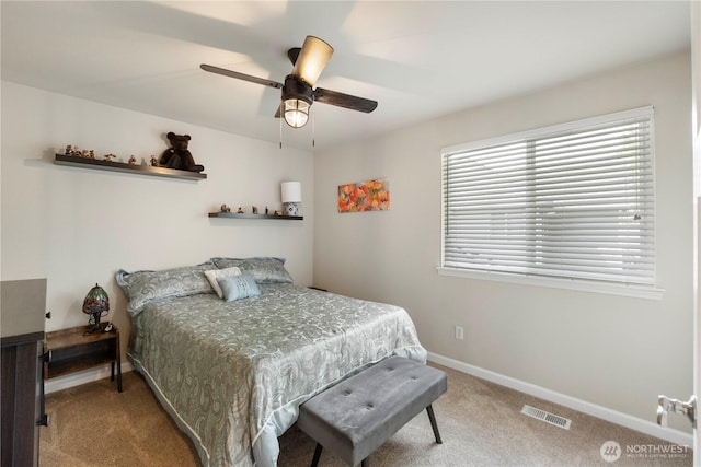 bedroom with carpet, baseboards, and a ceiling fan
