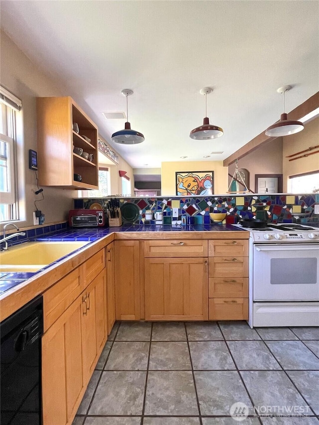 kitchen featuring white electric range oven, black dishwasher, tile countertops, and decorative light fixtures