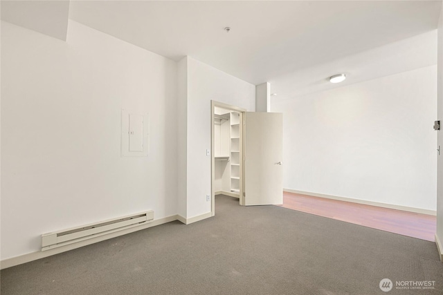 2960 Eastlake Ave E Unit 307, Seattle, WA 98102 - empty room featuring baseboard heating, carpet flooring, baseboards, and a pendent fire sprinkler