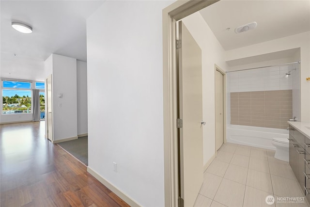2960 Eastlake Ave E Unit 307, Seattle, WA 98102 - hall with baseboards and light tile patterned floors
